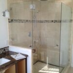 bathroom with bright light in southern california home with new custom glass shower doors