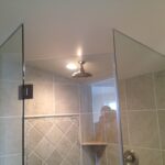 clean shower door installation view with light frameless and custom