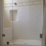 front view of glass shower door customization and installation
